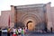 Tourists enter the door of BÄb AgnÄou in Marrakech